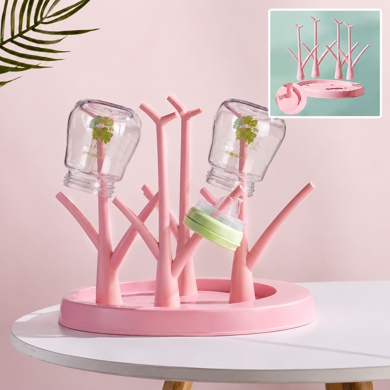 Support egouttoir biberons rose en forme arbre.