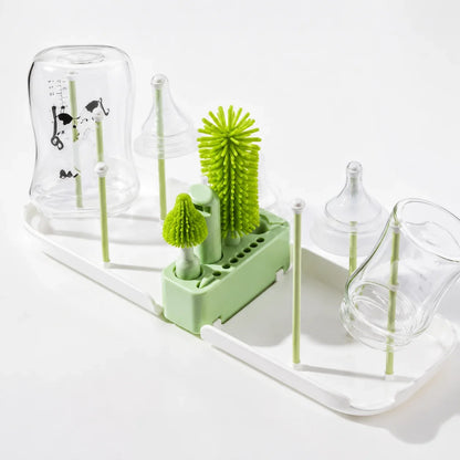 egouttoir biberon avec brosse verte.