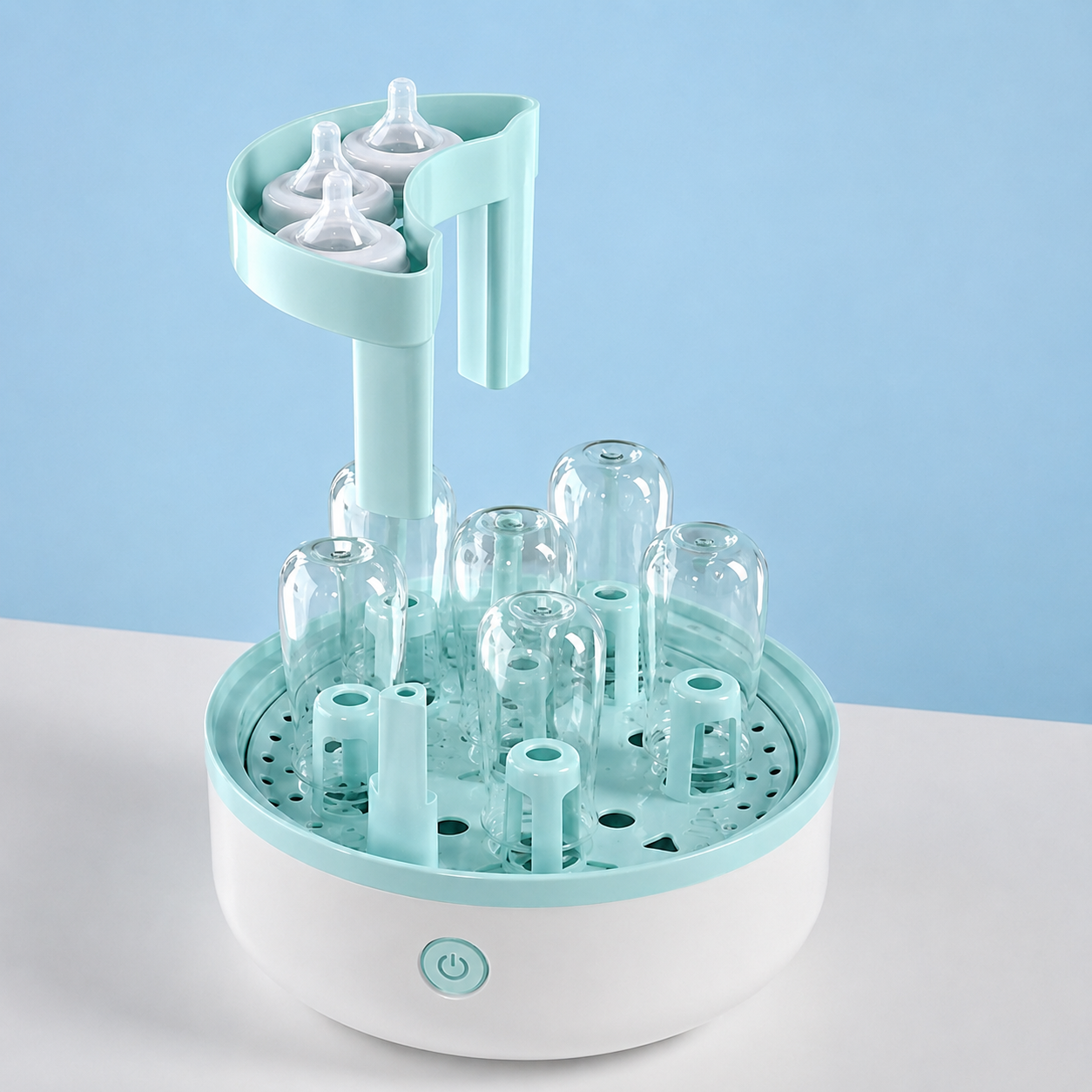 sterilisateur biberon ouvert avec tetines biberons en place.