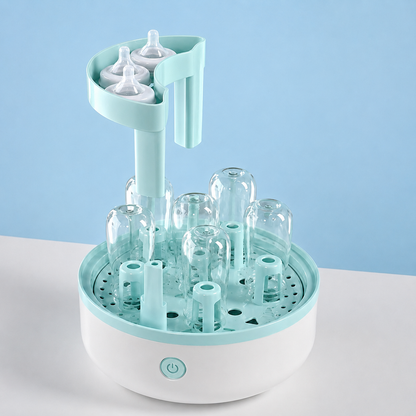 sterilisateur biberon ouvert avec tetines biberons en place.