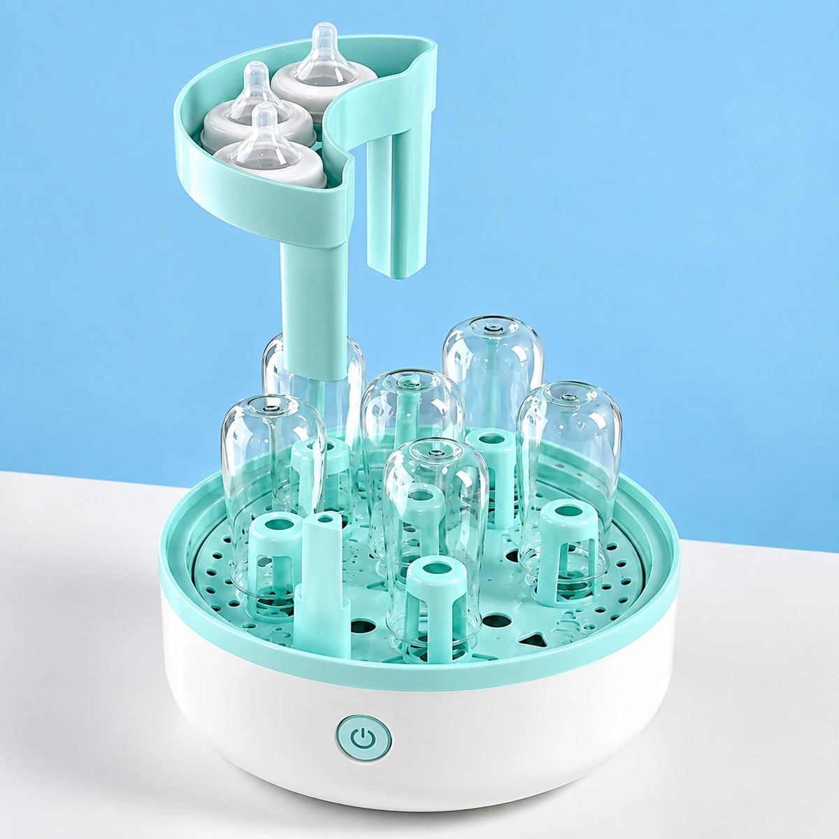 sterilisateur biberon ouvert avec tetines biberons en place.